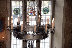 25F Metal Chandelier With Stained Glass Windows Behind In Banff Springs Hotel Mt Stephen Hall.jpg